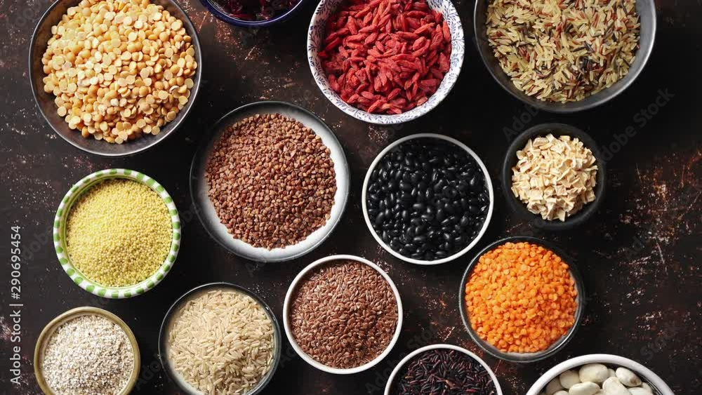 Various superfoods in smal bowls on dark rusty background Various superfoods in smal bowls on dark rusty background