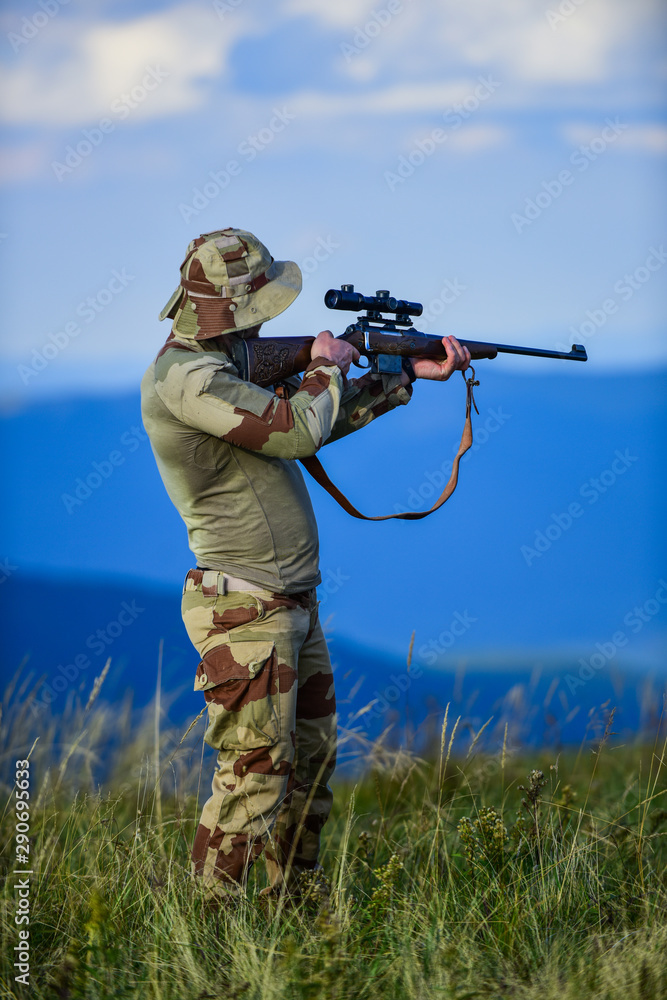 Fototapeta premium Masculine hobby activity. military male fashion. war time. soldier in service. weapon shop concept. weapon permit. hunter in camouflage. security of democracy. defender of motherland. man with gun