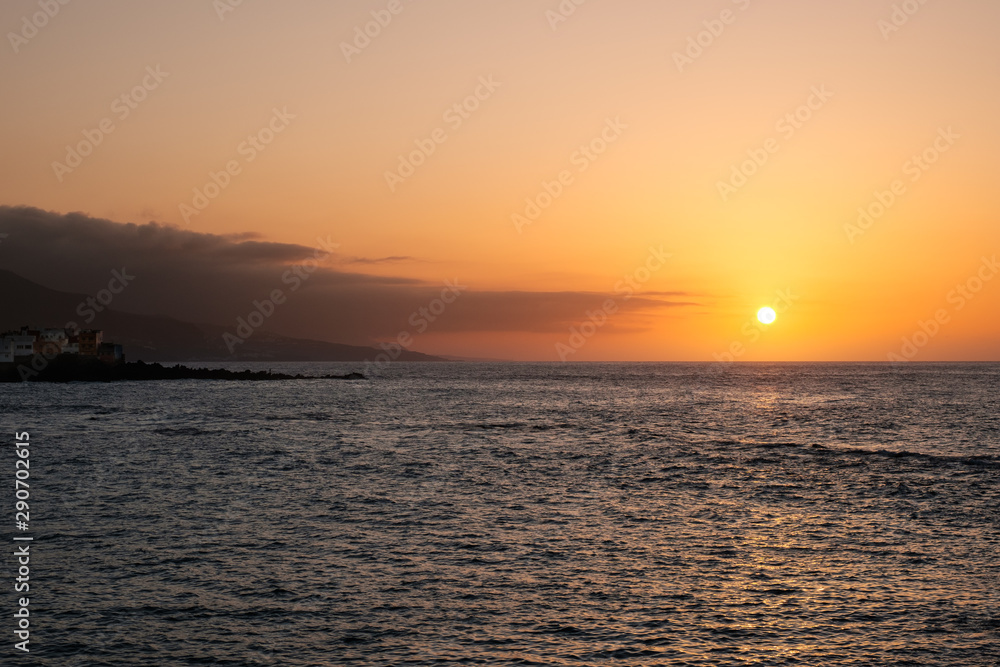 ocean coast with sunset sky background