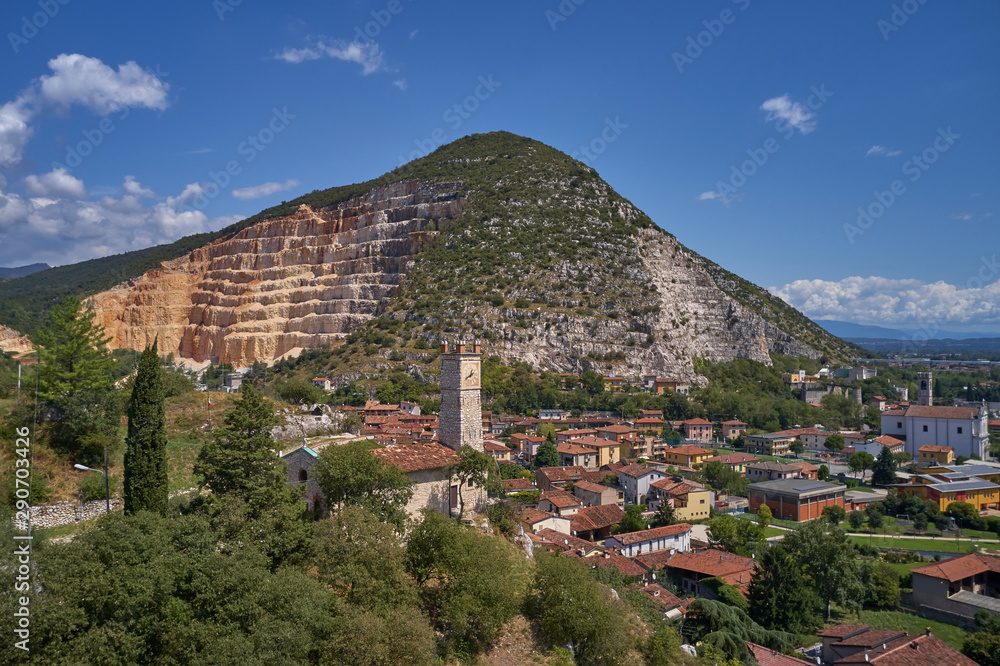 Obraz premium Air view of a marble quarry. Panoramic view of the extraction of marble in the quarry. Technique in the marble quarry of Brescia, Italy. Open pit mine.