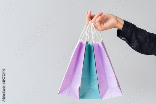 Close-up of hand holding gift bags