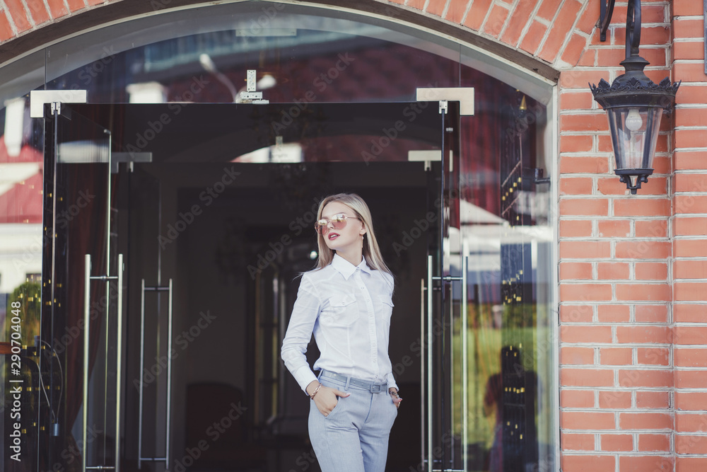 trendy look girl in business clothes posing in the city trendy look girl in business clothes posing in the city