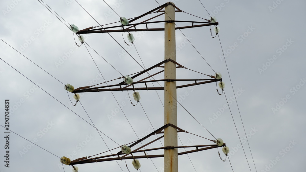 Electric pole with wires against the blue sky Electric pole with wires against the blue sky