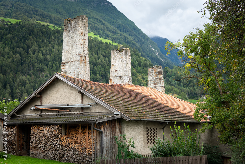 Remains of the old aqueduct in Laas on a cloudy day in summer