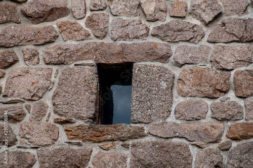 small window in stone wall .Lozere   France 