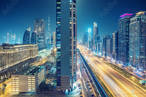 Downtown Dubai at night. Elevated view on highways and skyscrapers. © Funny Studio