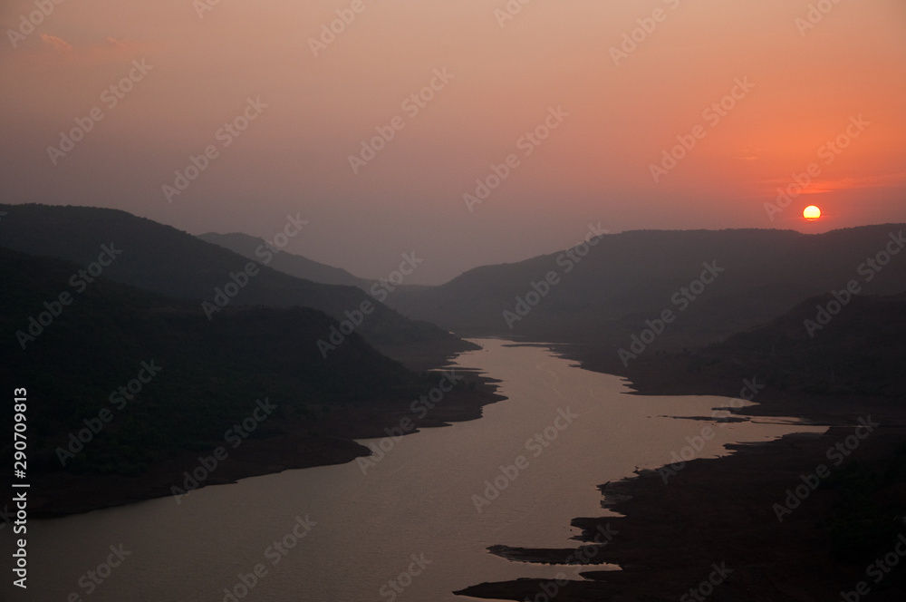 sunset over the rivers and mountains