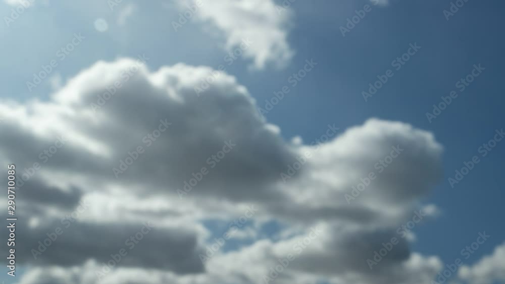 White and gray clouds pass quickly across the blue sky, time lapse White and gray clouds pass quickly across the blue sky, time lapse