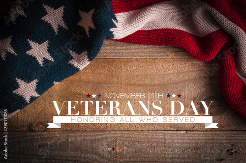 Veterans Day: Stars and stripes scarf on a wooden table and an inscription for the Veterans day celebrations photo