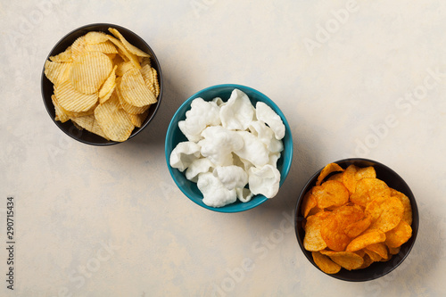 Bowls with snacks like chips, crisps, popcorn. Perfect for a party. Top view.