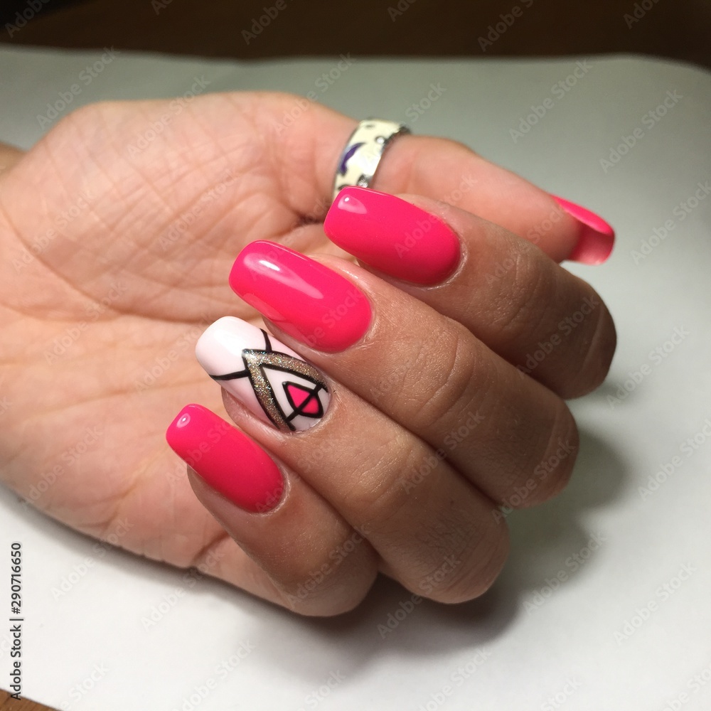 Female hands with stylish red manicure on grey background Female hands with stylish red manicure on grey background