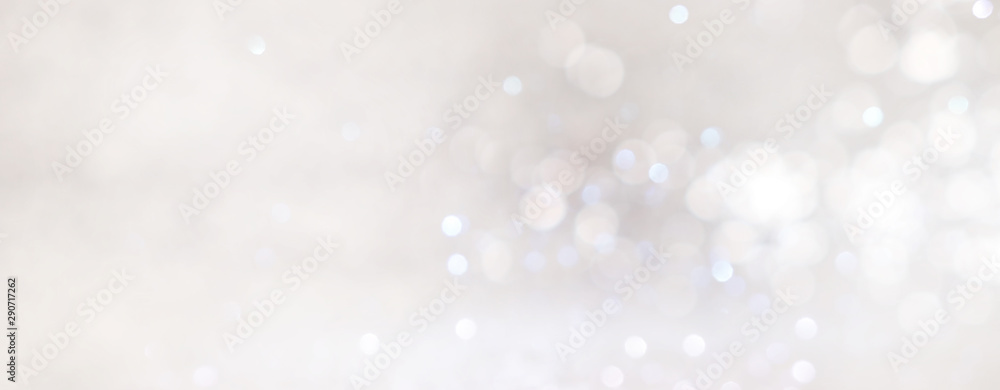 abstract backgrounf of glitter vintage lights . silver and white. de-focused. banner