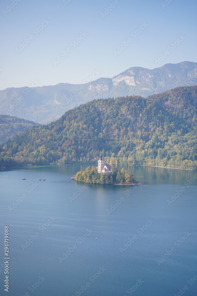 Travailing around Lake Bled In Slovenia an amazing lake full of impressive nature , crystal blue water with a beautiful island in the middle surrounded by those beautiful mountains and trees. Travailing around Lake Bled In Slovenia an amazing lake full of impressive nature , crystal blue water with a beautiful island in the middle surrounded by those beautiful mountains and trees.