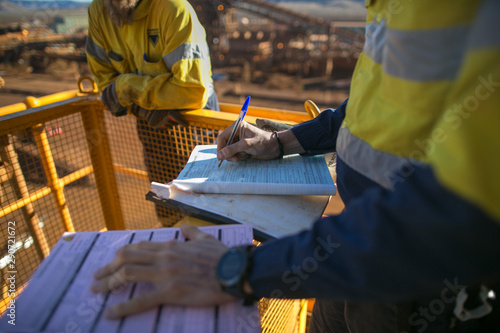 Картината върху платно Miner supervisor sigh of working at height working permit prior to performing hi