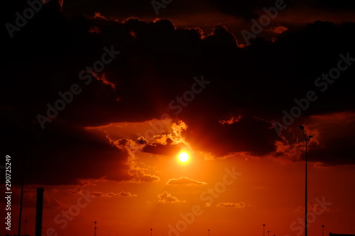 Sunset background and sun beam on the open seaGold sunset light on the ocean. photo