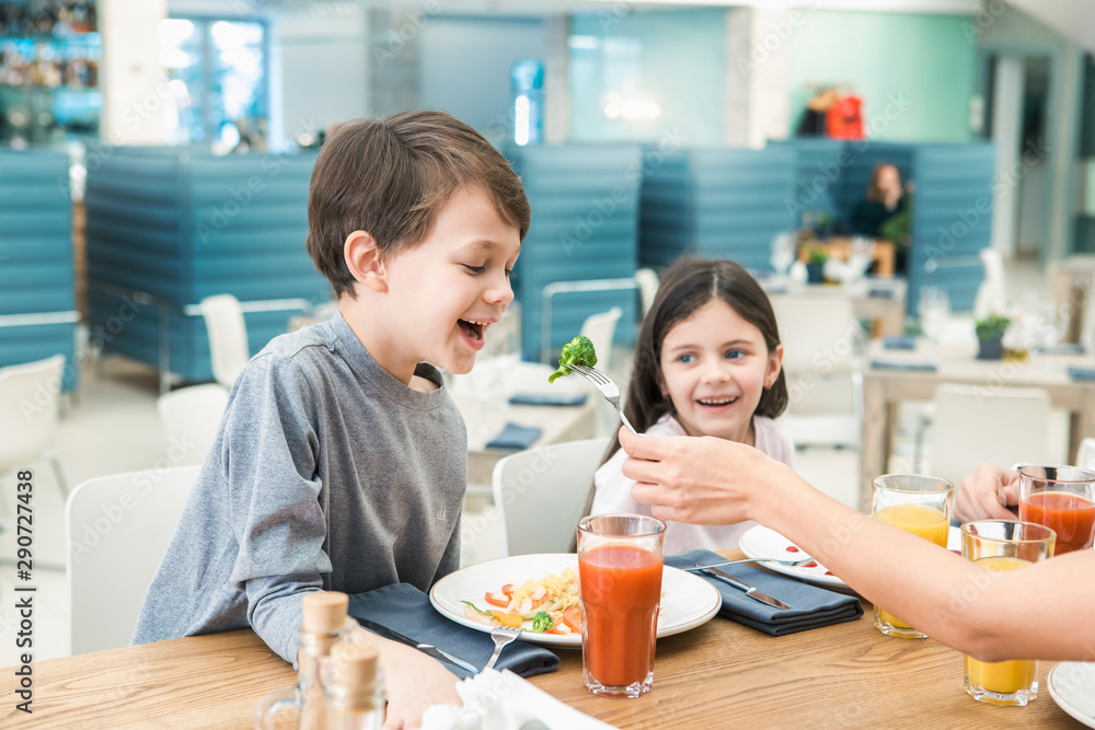 Family Sitting Together in the Restaurant Lunch Concept
