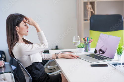 serious young woman sitting with laptop.Asian business woman