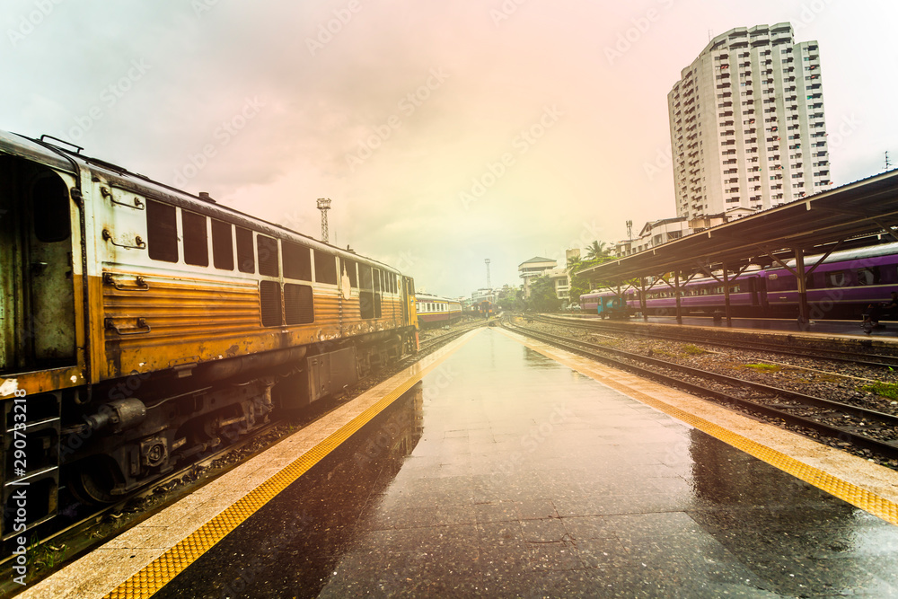 Fototapeta premium train station with train waiting for tourists to travel out of the province on weekends to relax