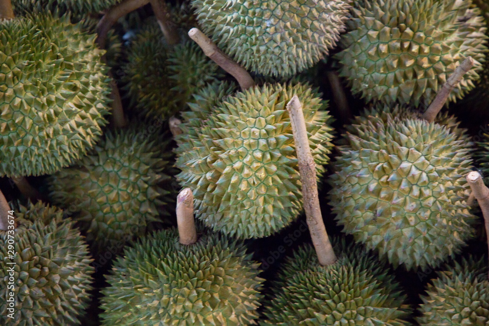 heap of durian fruits in market . heap of durian fruits in market .