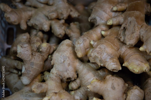 heap of ginger vegetable in market .
