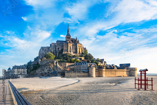 Vászonkép Dawn in Mont Saint Michel and its abbey with the sea at low tide