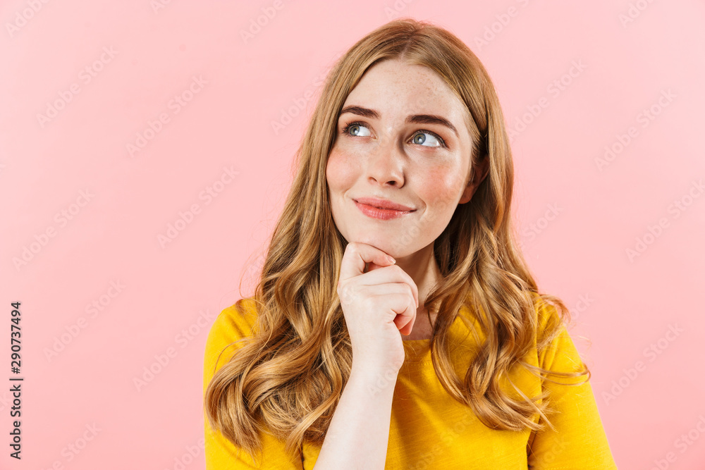 Dreaming cute girl isolated over pink wall background looking aside. Dreaming cute girl isolated over pink wall background looking aside.