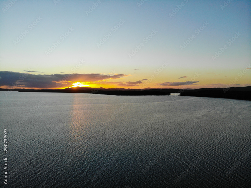 Sunset over water (left)