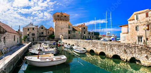 Travel and landmarks of Croatia. Kastel Gomilica - old castle over the sea, popular tourist attraction near Split. Damatia photo