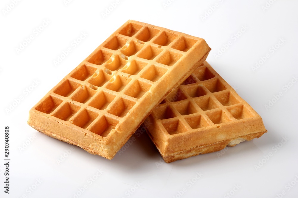 Belgian waffles. Baked waffles on a white background. Belgian waffles. Baked waffles on a white background.