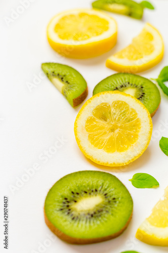 Top View of Lemon Kiwi and Peppermint on White Background  Free Space for Text