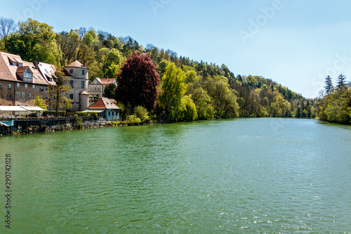 Houses in forest by side of lake
