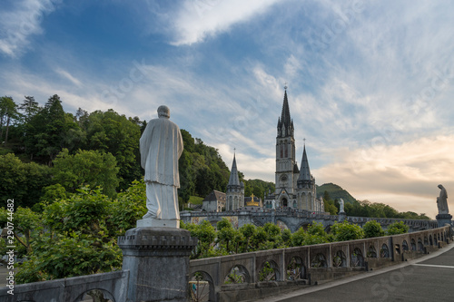 View of the Catholic Sanctuary of Our Lady of Lourdes (France) during sunset.