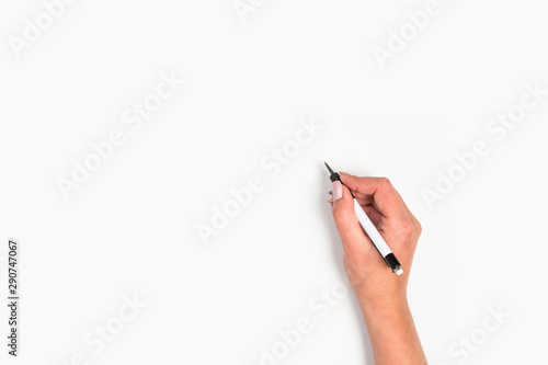 Female hand is ready for drawing with pen on white background