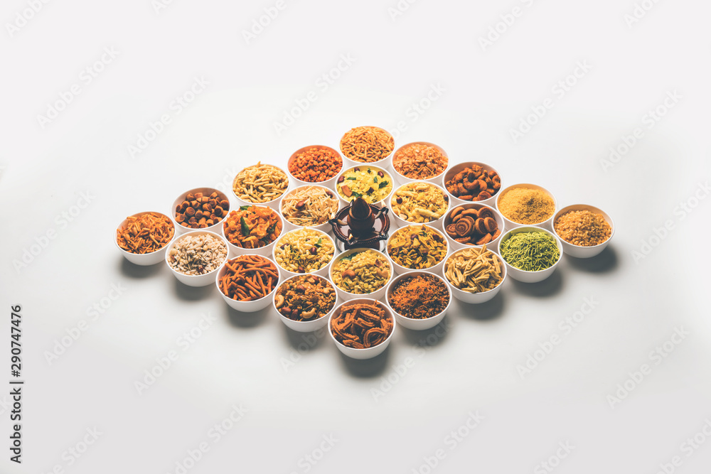 Rangoli of Farsan/snacks in bowls for Diwali with diya Rangoli of Farsan/snacks in bowls for Diwali with diya