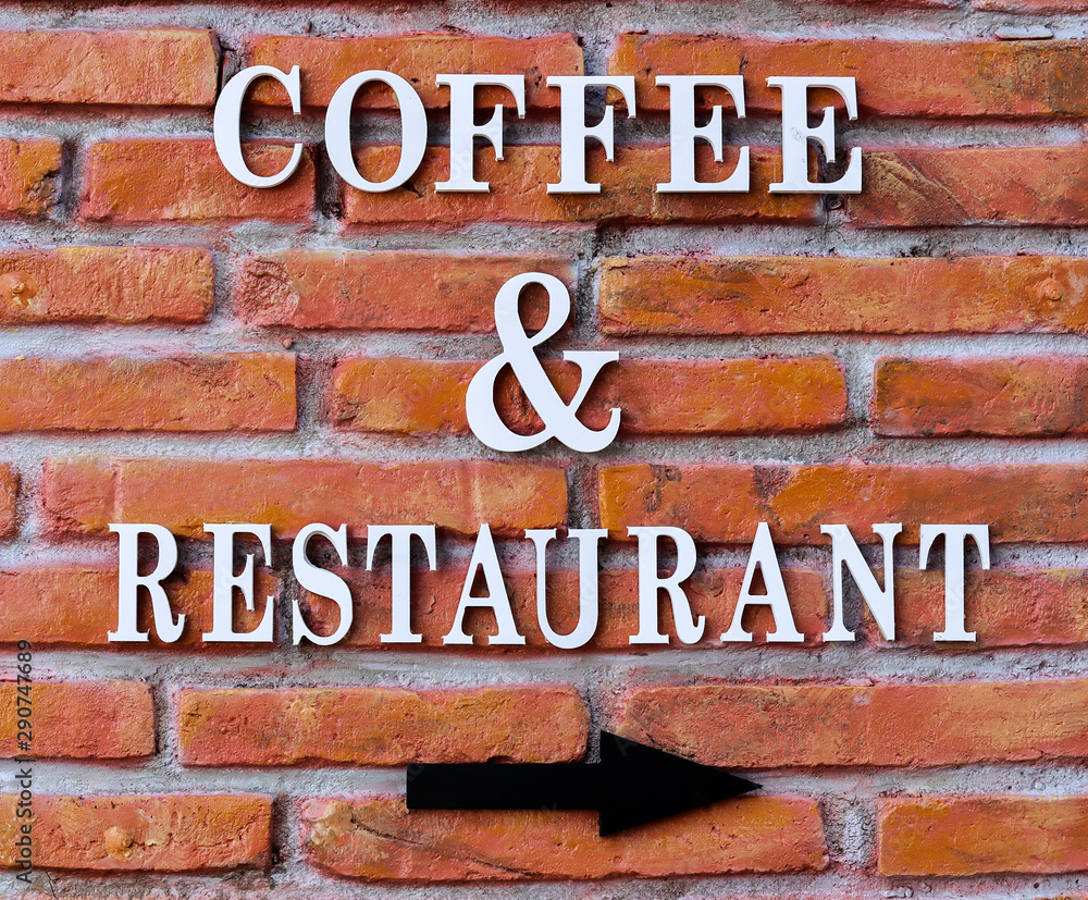 Fototapeta coffee and restaurant label on old brick wall.