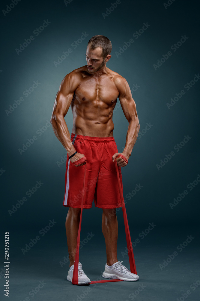Muscular Men Exercising With Resistance Band Muscular Men Exercising With Resistance Band