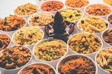 Rangoli of Farsan/snacks in bowls for Diwali with diya