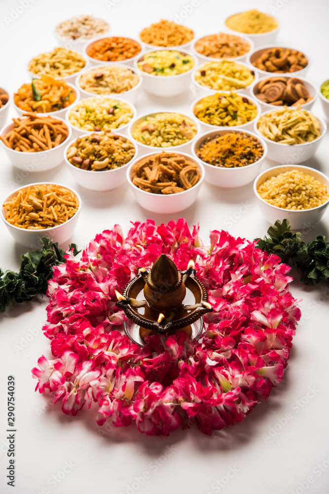 Rangoli of Farsan/snacks in bowls for Diwali with diya Rangoli of Farsan/snacks in bowls for Diwali with diya