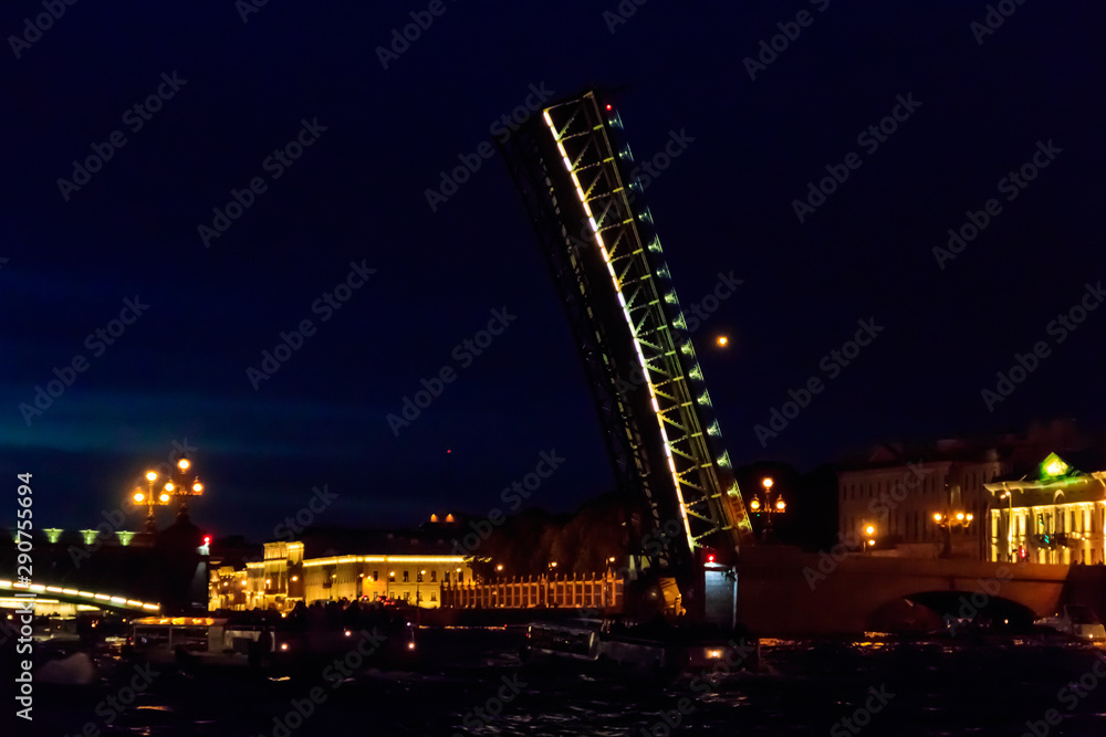 Opening of Trinity drawbridge. Night view of Trinity bridge from the Neva river in St. Petersburg, Russia