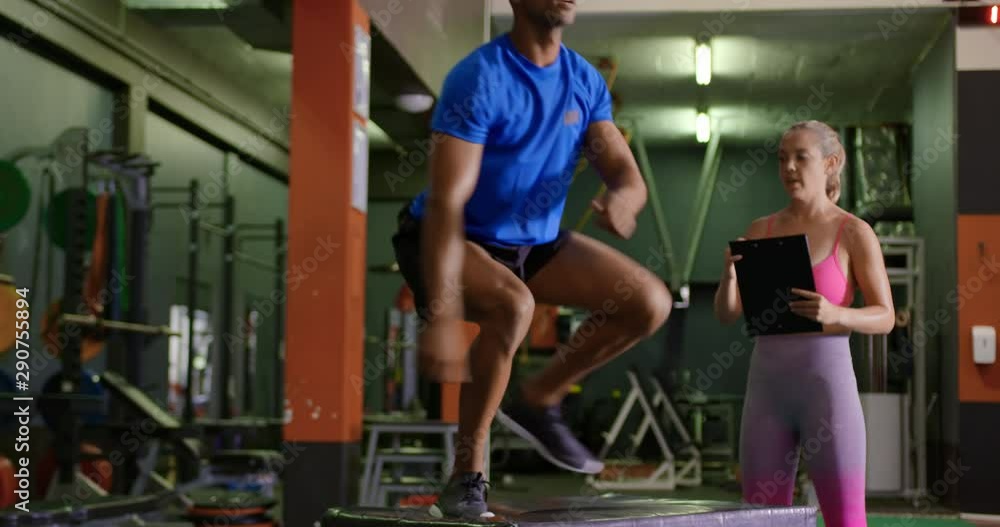 Man exercising in a gym Man exercising in a gym