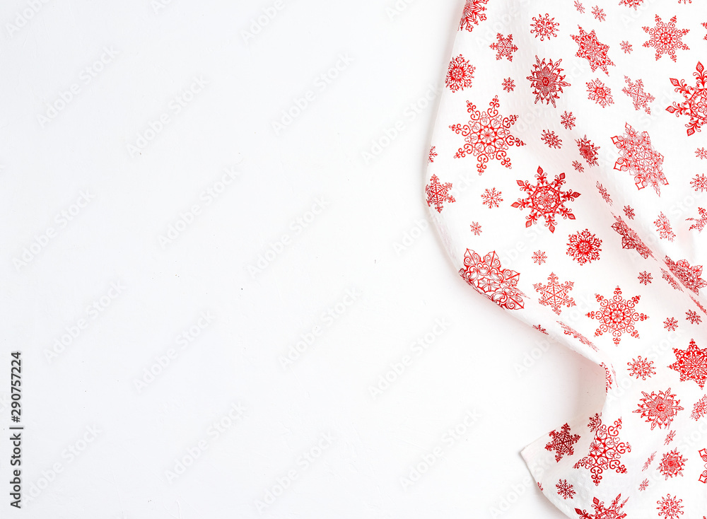 Christmas composition. Christmas gift, knitted blanket, pine cones, fir branches on wooden white background. Flat lay, top view, copy space Christmas composition. Christmas gift, knitted blanket, pine cones, fir branches on wooden white background. Flat lay, top view, copy space