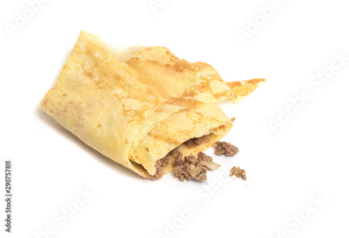 Pancakes with meat on a white background. Shawarma food on the go.
