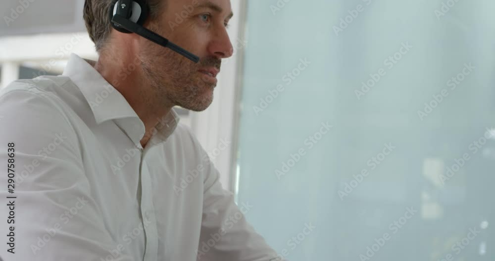 Middle aged man working in a creative office Middle aged man working in a creative office