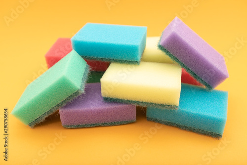 sponges for dishwashing isolated on yellow background
