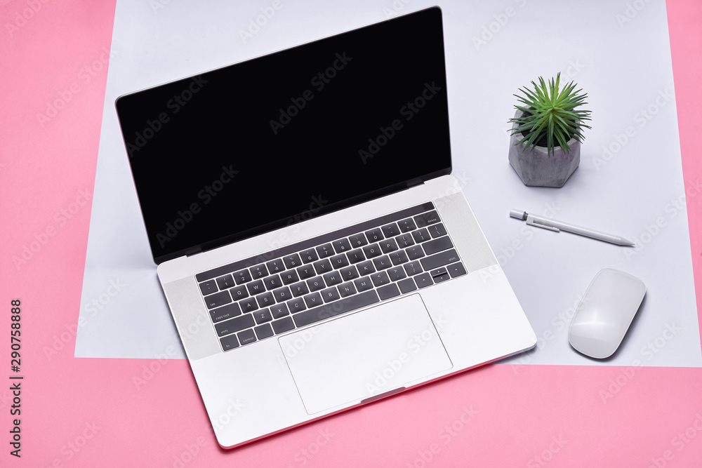 Front view of the laptop is on the work table, concrete background, clipping path inside Front view of the laptop is on the work table, concrete background, clipping path inside