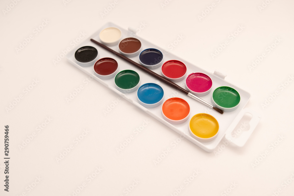 watercolor paints in box on white background watercolor paints in box on white background