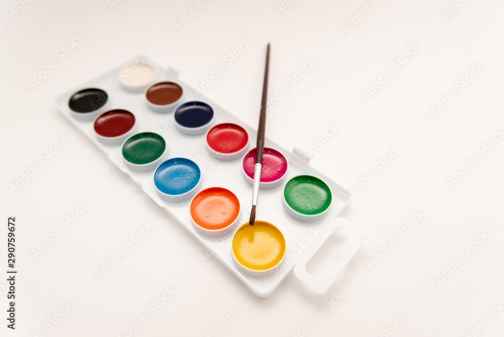 watercolor paints in box on white background watercolor paints in box on white background