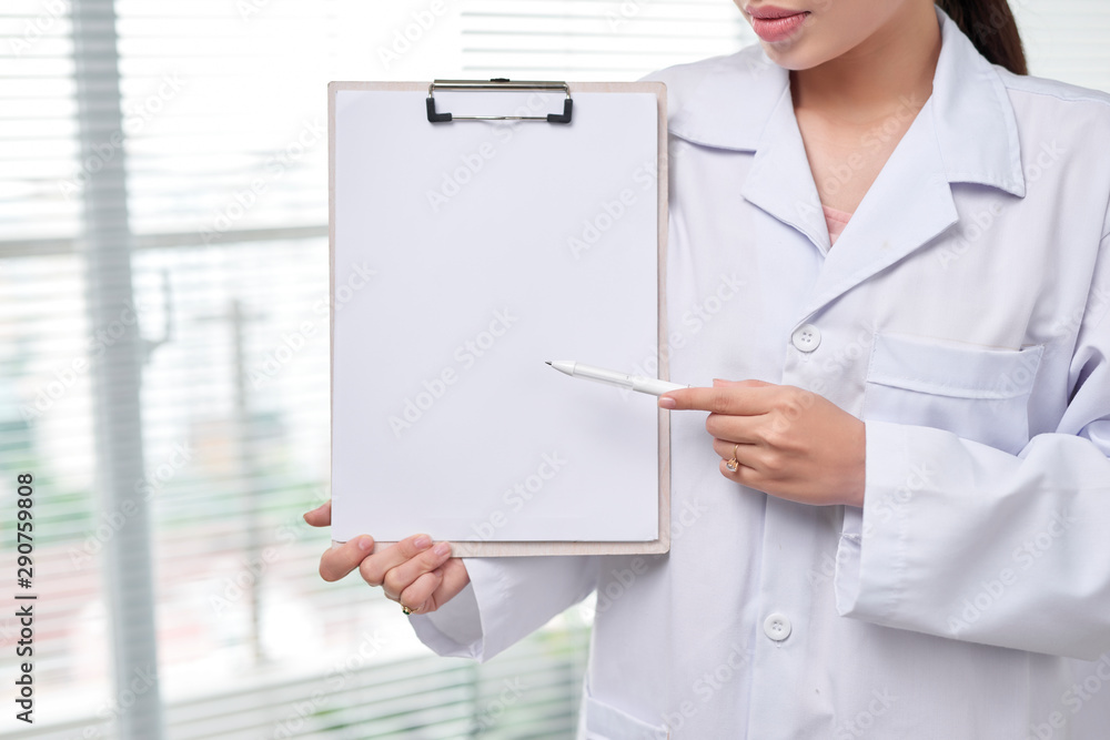 Female Doctor show with clipboard