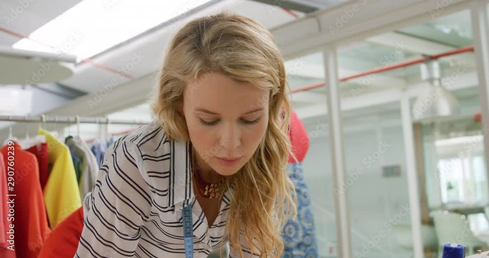 Young woman working in a fashion studio Young woman working in a fashion studio