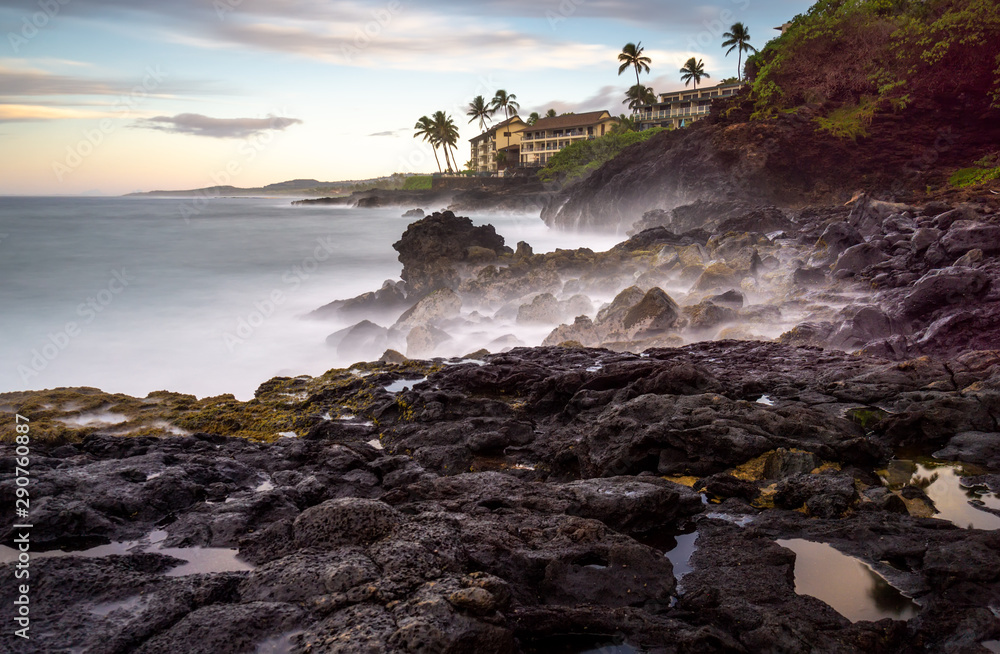 early dawn at poipu point, kauai. the low light forced a very long exposure, turning the crashing surf into a soft fog.